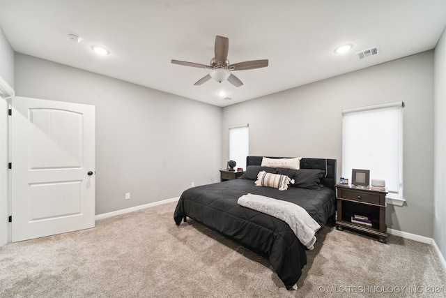 carpeted bedroom with ceiling fan