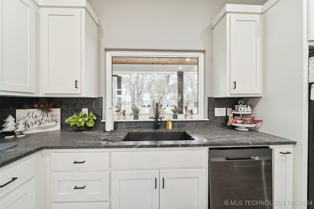 kitchen featuring backsplash, sink, white cabinets, and stainless steel dishwasher