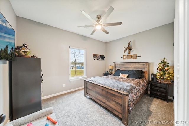 bedroom featuring ceiling fan and light colored carpet