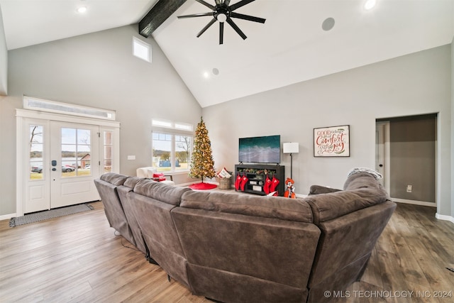 living room featuring ceiling fan, beamed ceiling, high vaulted ceiling, and light wood-type flooring