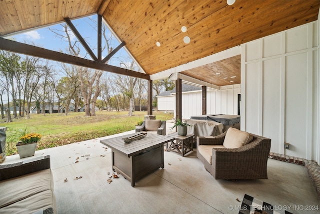 view of patio featuring an outdoor living space with a fire pit