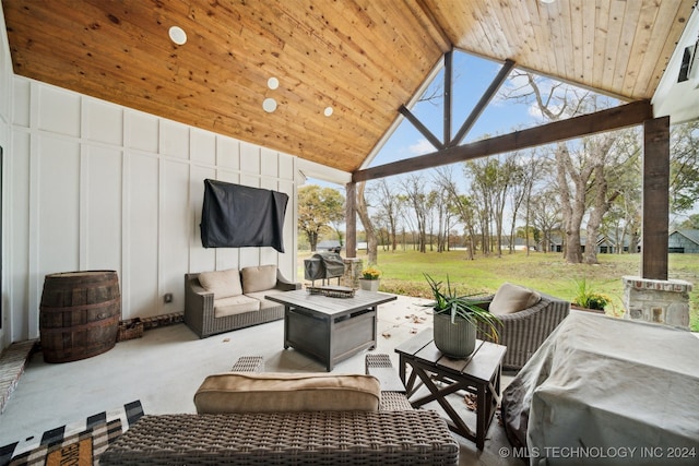 view of patio featuring an outdoor living space with a fire pit