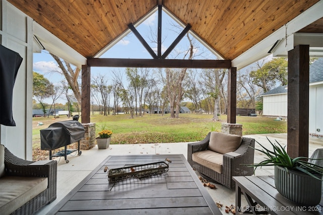 deck featuring a gazebo, area for grilling, a patio area, and a yard