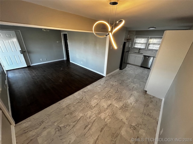 unfurnished dining area with hardwood / wood-style flooring and sink