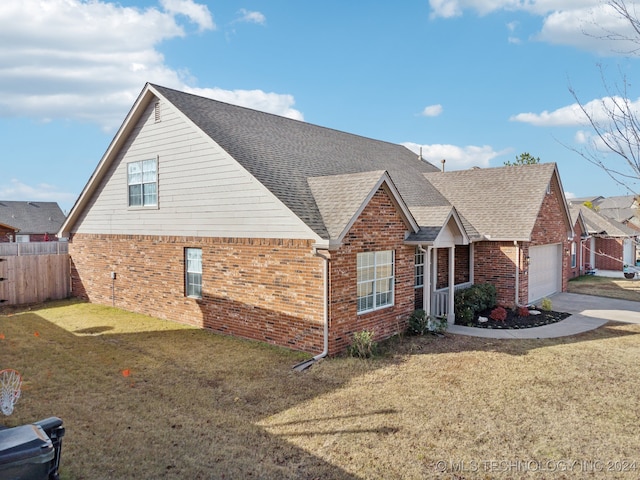 view of front of property featuring fence, a shingled roof, concrete driveway, a garage, and brick siding