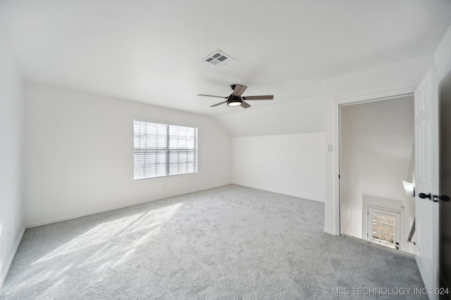 bonus room featuring a ceiling fan, visible vents, carpet floors, baseboards, and vaulted ceiling