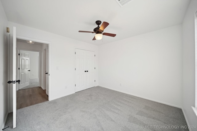 unfurnished bedroom featuring visible vents, baseboards, carpet, and ceiling fan