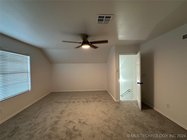 bonus room with visible vents, carpet floors, a ceiling fan, and vaulted ceiling