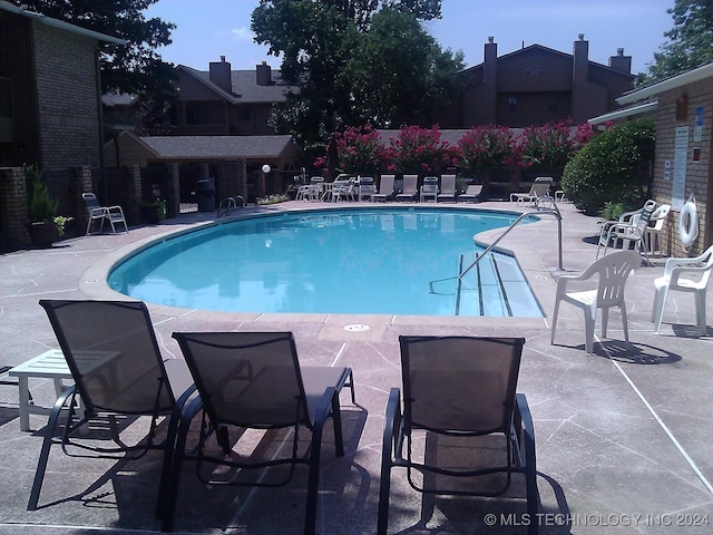 pool with a patio