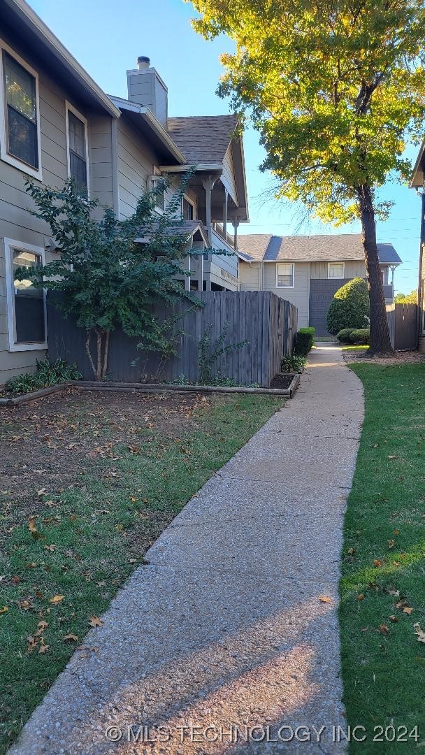 view of home's exterior with a yard