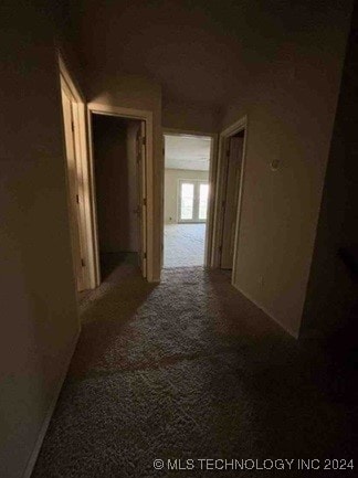 corridor with carpet flooring