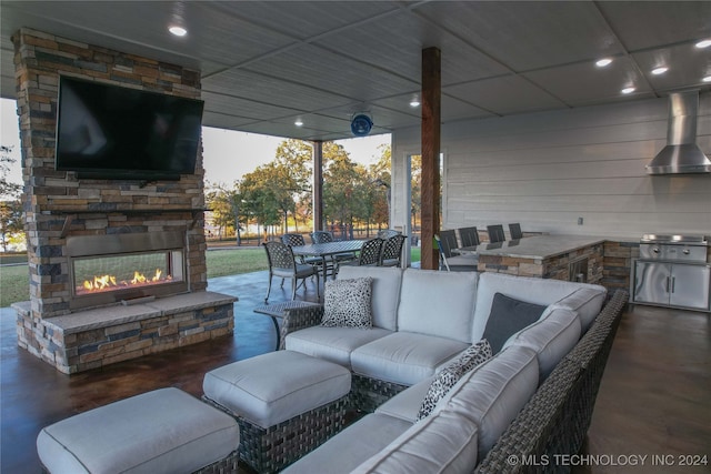 view of patio featuring an outdoor living space with a fireplace and grilling area