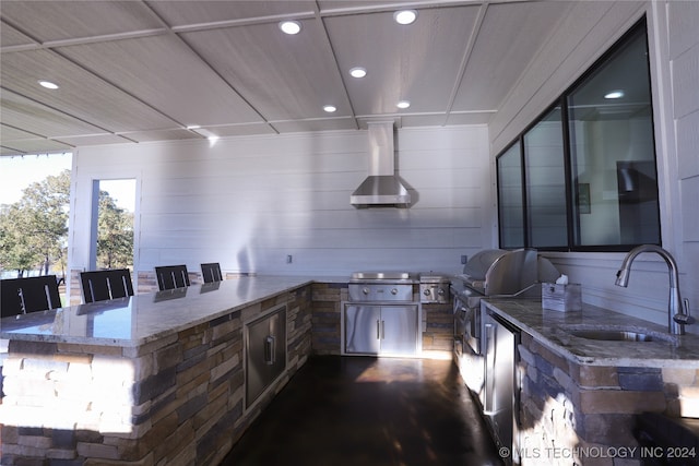 view of patio with area for grilling, sink, and grilling area