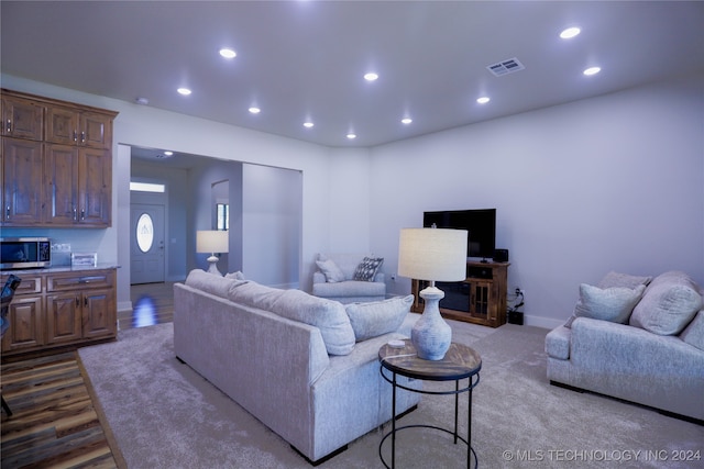 living room with light hardwood / wood-style flooring