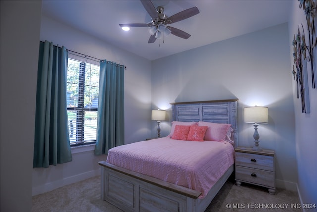 carpeted bedroom with ceiling fan