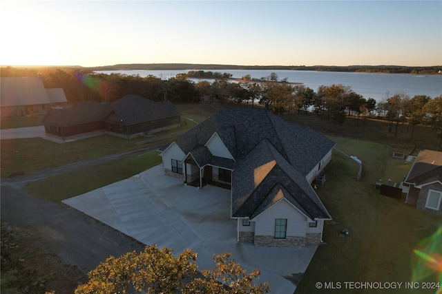 aerial view at dusk with a water view