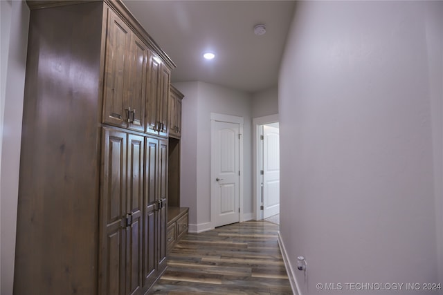 hallway with dark hardwood / wood-style floors