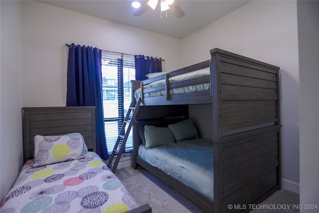 bedroom featuring light carpet and ceiling fan