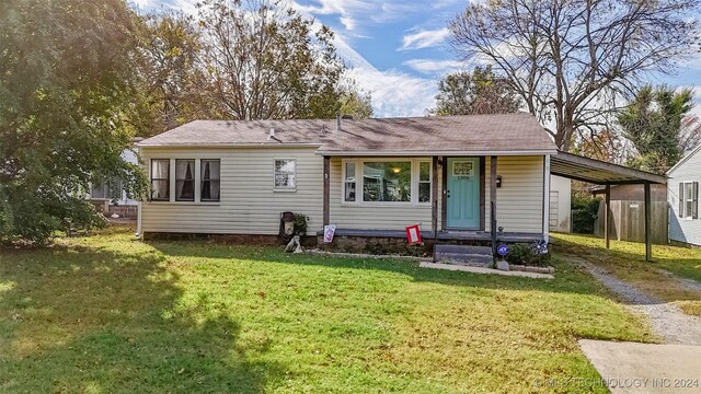 1306 E Comanche Ave, Mcalester, OK 74501 - view of front facade featuring driveway and a front lawn