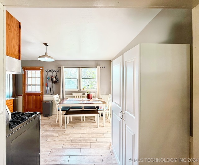 dining space with lofted ceiling