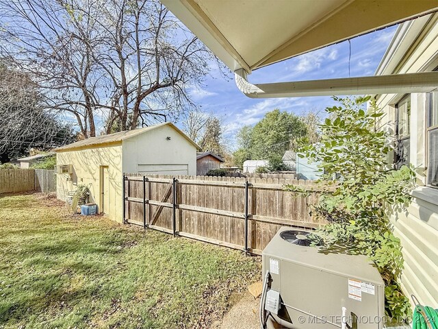 1306 E Comanche Ave, Mcalester, OK 74501 - view of yard with central AC and an outbuilding