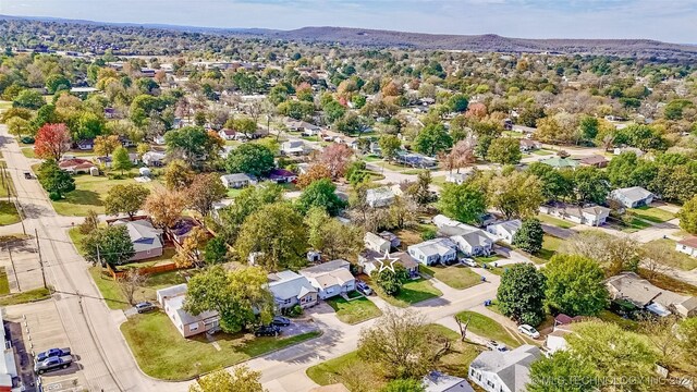1306 E Comanche Ave, Mcalester, OK 74501 - aerial view of residential area featuring a mountainous background