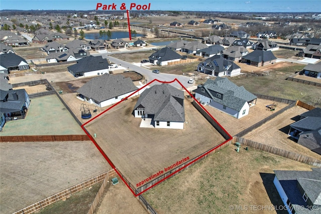 aerial view featuring a residential view and a water view