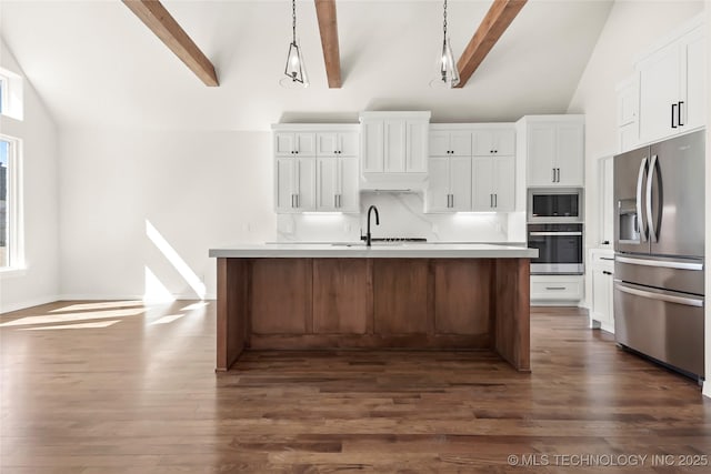 kitchen with appliances with stainless steel finishes, dark wood-style floors, beam ceiling, white cabinetry, and high vaulted ceiling