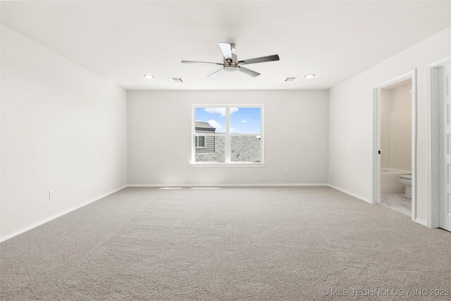 unfurnished room with ceiling fan, carpet flooring, and baseboards