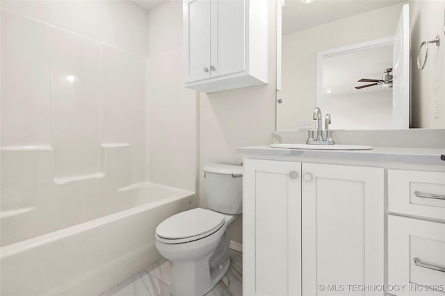 bathroom with toilet, vanity, and shower / washtub combination