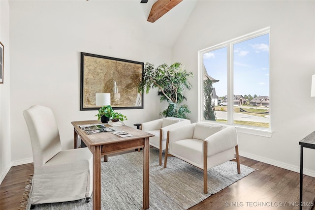 home office featuring beam ceiling, baseboards, wood finished floors, and a healthy amount of sunlight