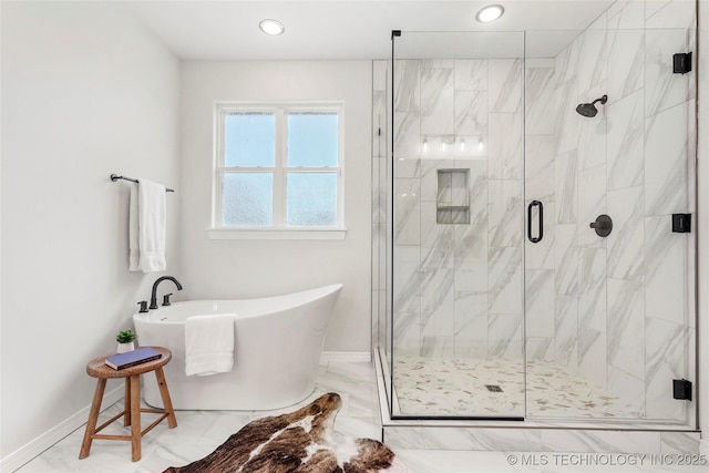 full bath featuring baseboards, a soaking tub, recessed lighting, marble finish floor, and a stall shower