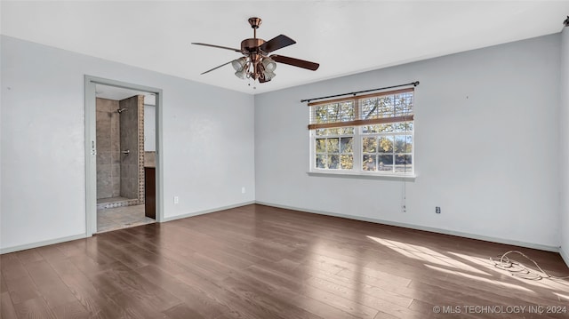 unfurnished bedroom with connected bathroom, ceiling fan, and hardwood / wood-style flooring