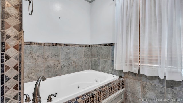 bathroom with tiled tub