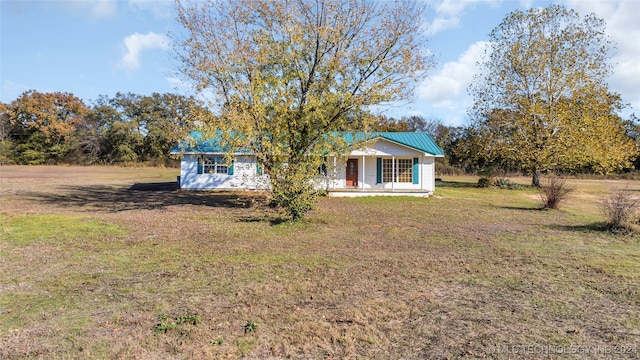 view of front of home with a front lawn and a porch