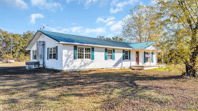 single story home with covered porch and central air condition unit