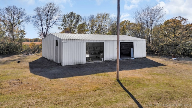 view of outbuilding featuring a lawn