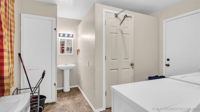 interior space with washer / clothes dryer and sink