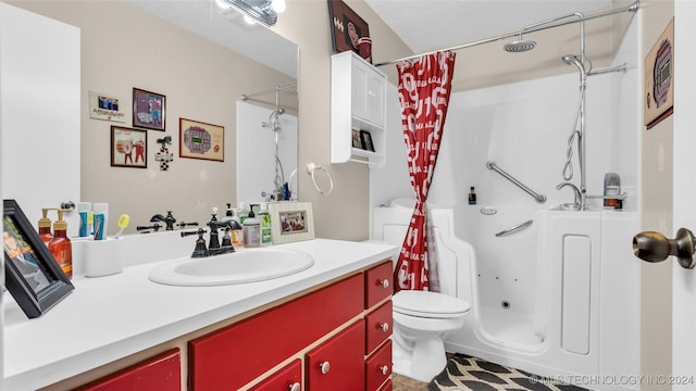 bathroom featuring tile patterned floors, vanity, and toilet