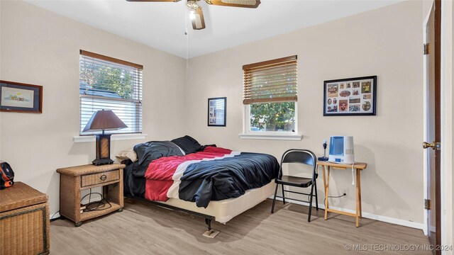 bedroom featuring ceiling fan and light hardwood / wood-style flooring