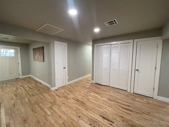 basement featuring light hardwood / wood-style floors