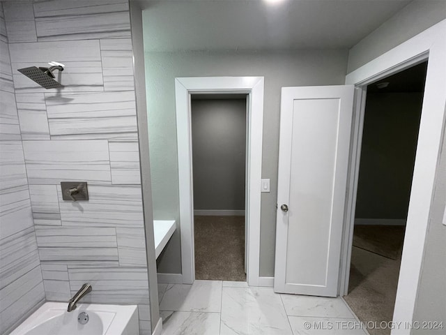 bathroom featuring tiled shower / bath combo