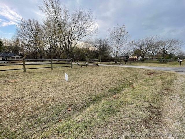 view of yard with a rural view