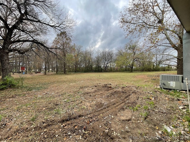 view of yard with central AC