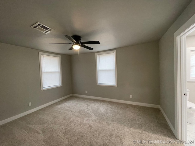 carpeted empty room with ceiling fan