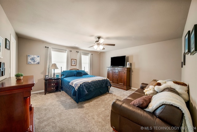 bedroom featuring ceiling fan and light colored carpet