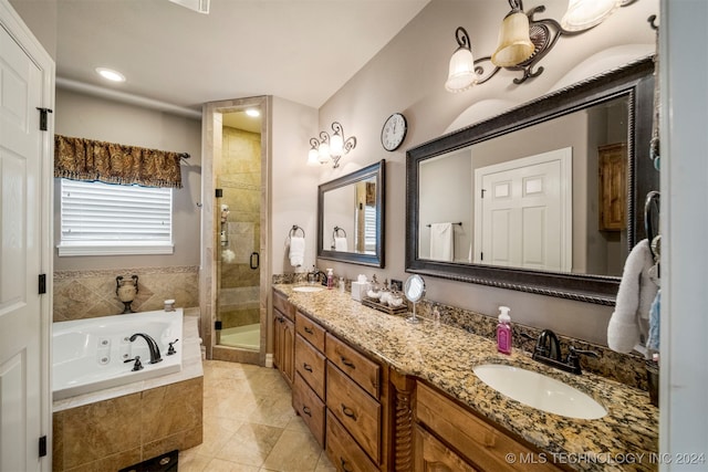 bathroom with vanity, independent shower and bath, and tile patterned flooring