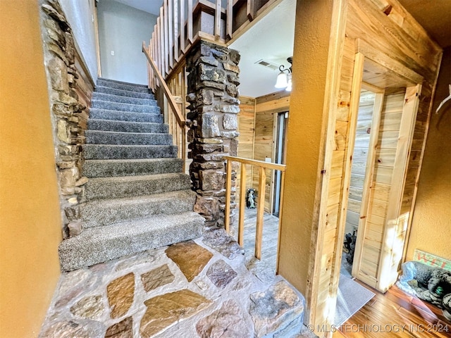 stairway featuring hardwood / wood-style floors