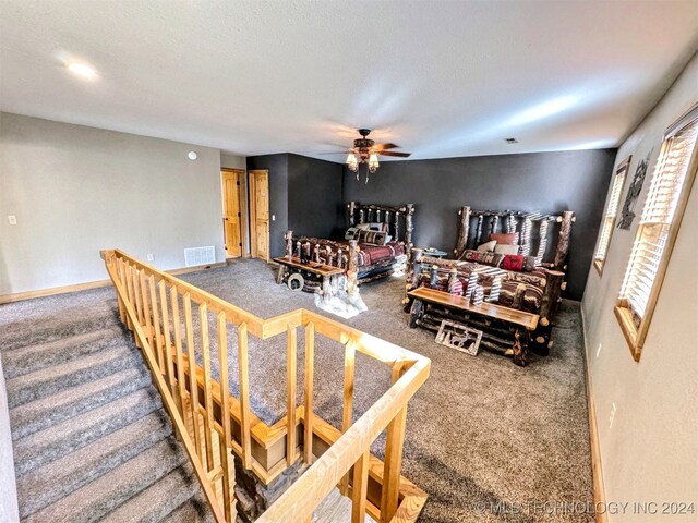 bedroom featuring ceiling fan and carpet floors