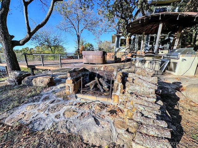 view of patio / terrace with a hot tub